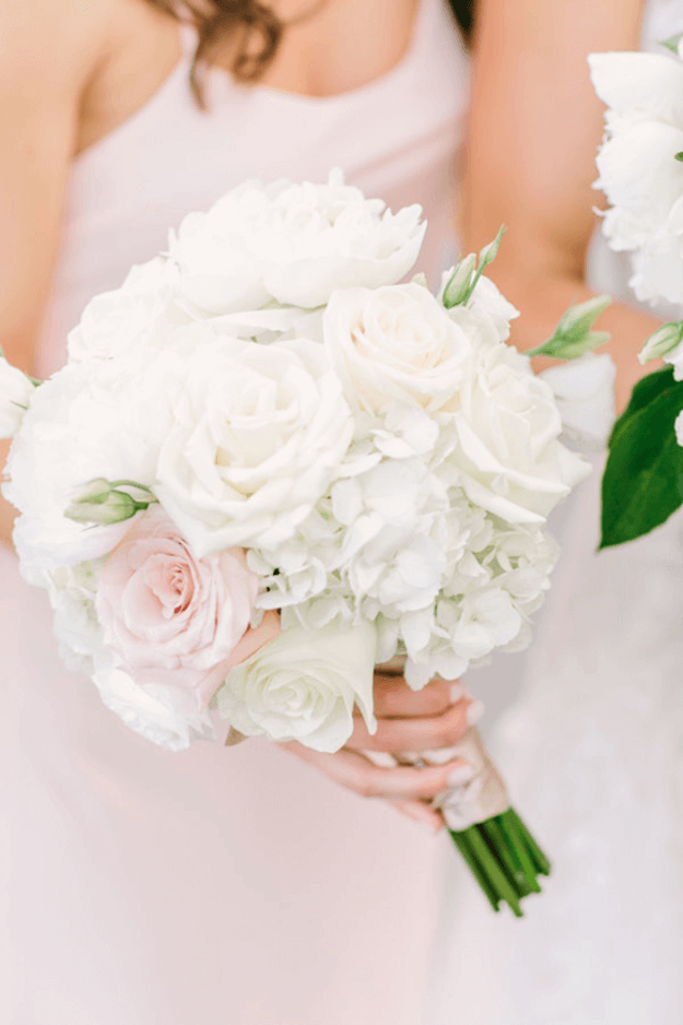 white flower bouquet and blush pink dress