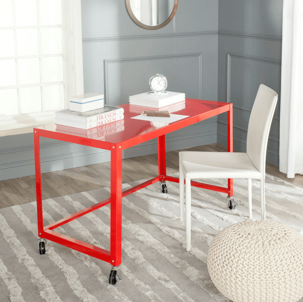 bright red metal desk on casters