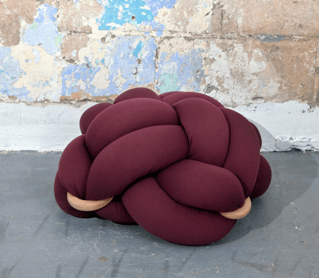 burgundy floor knot cushion