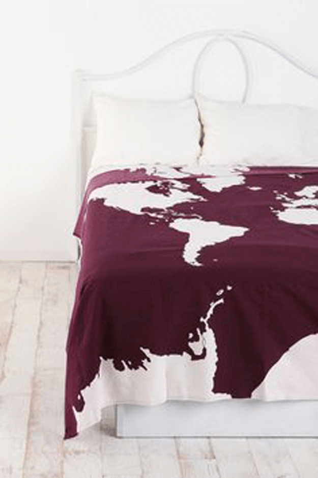 white bedroom with burgundy atlas blanket