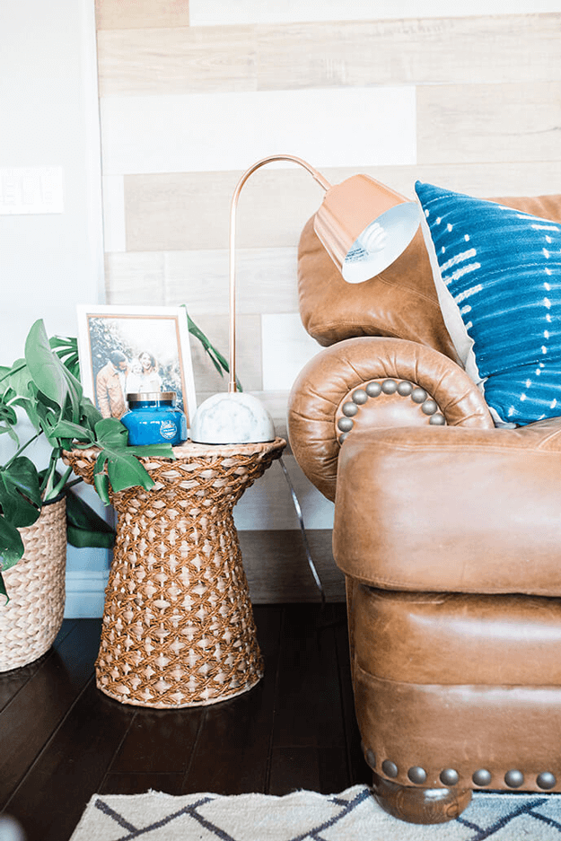 camel leather sofa closeup with woven side table