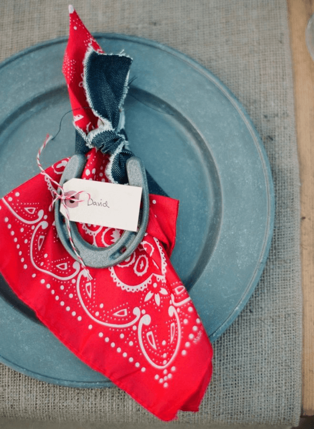 farm inspired table setting with red hankerchief napkins