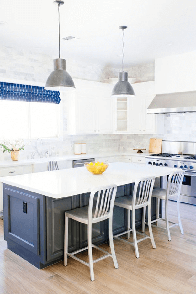 white kitchen with navy blue and stainless steel accents