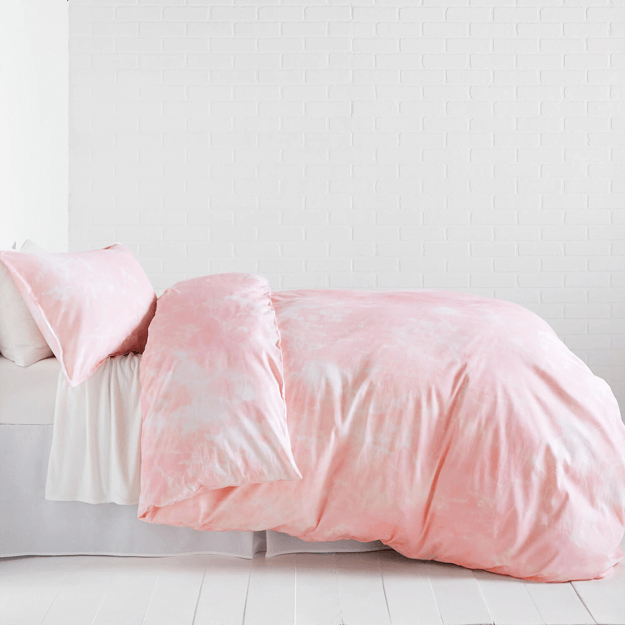 blush pink duvet cover in white bedroom