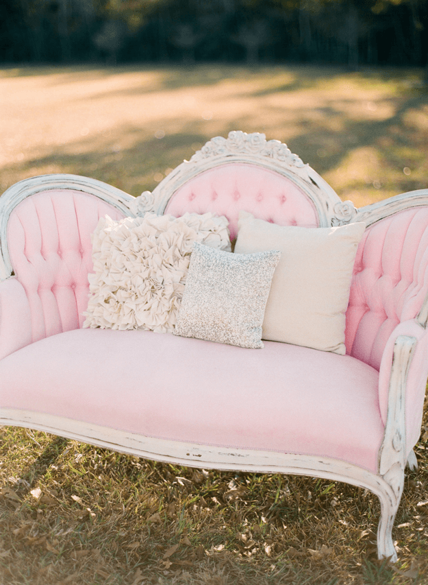 blush pink settee in grass field