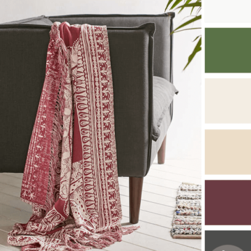 burgundy medallion throw blanket on dark gray linen chair