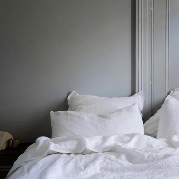 gray bedroom with white linen bedding