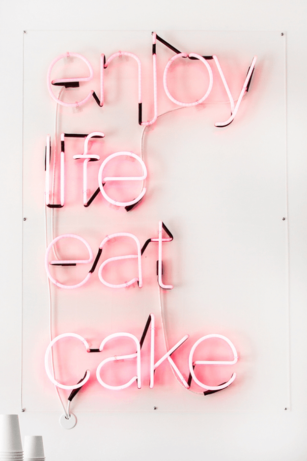 enjoy life eat cake pink neon sign