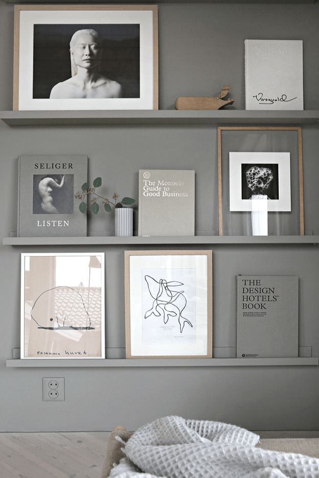 warm grey art and book wall