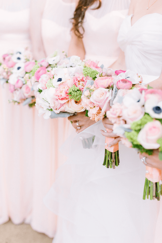 line of bridesmaids with blush pink bouquets