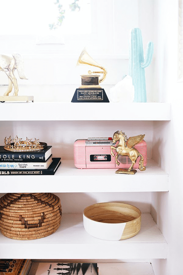 white bookshelf with blush pink accents