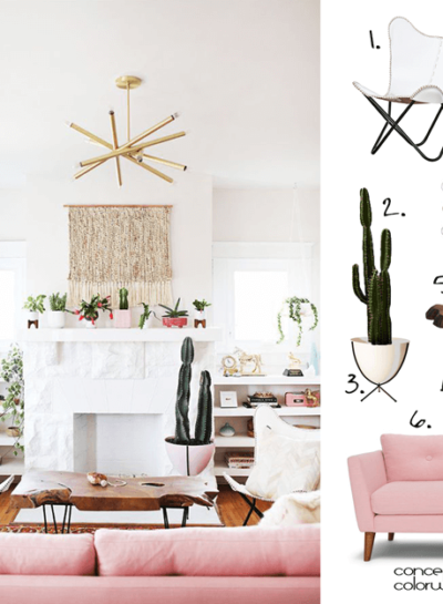 A WHITE LIVING ROOM WITH BLUSH PINK AND BRASS ACCENTS