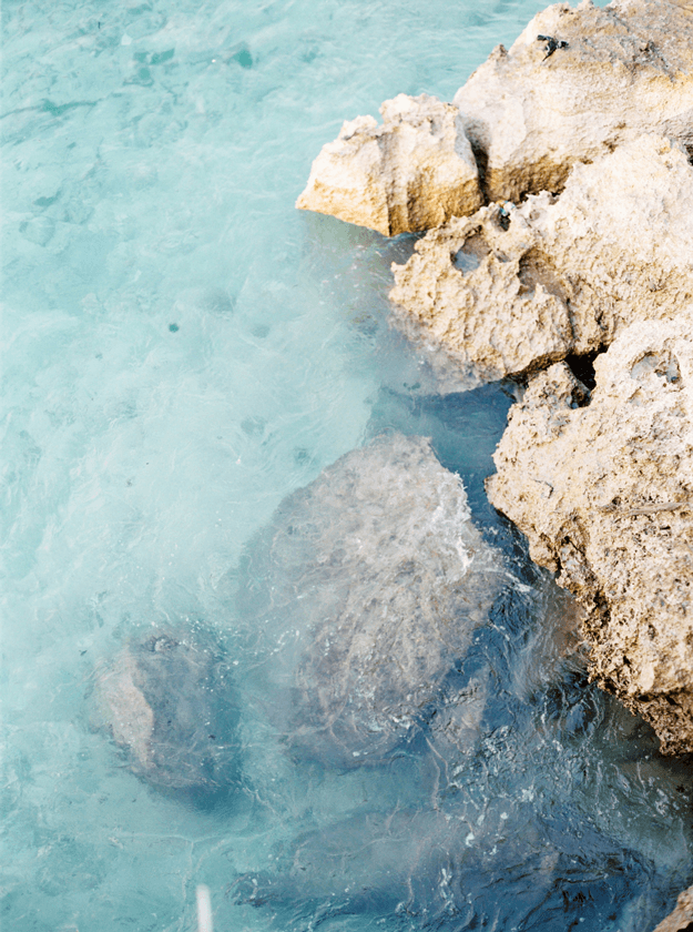 turquoise water with rocky shore