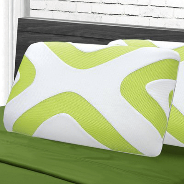 lime green and white patterned pillow