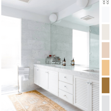ochre, golden yellow, dove gray, light peach, chalky white, modern bathroom, white bathroom, vintage rugs, white marble tile, louvered cabinet, free standing towel rack, globe wall sconce, striped towels, woven baskets, vintage oushak rug, vintage