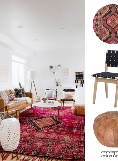 A VINTAGE LIVING ROOM WITH PINK RUG AND TAN LEATHER POUF